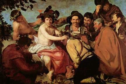 Group of men in a festive gathering with wine and grapes.