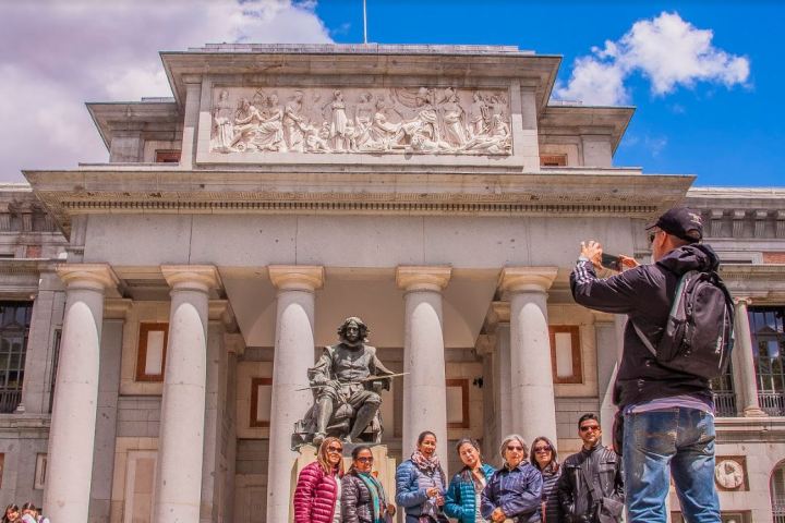 a group of people standing in front of a building