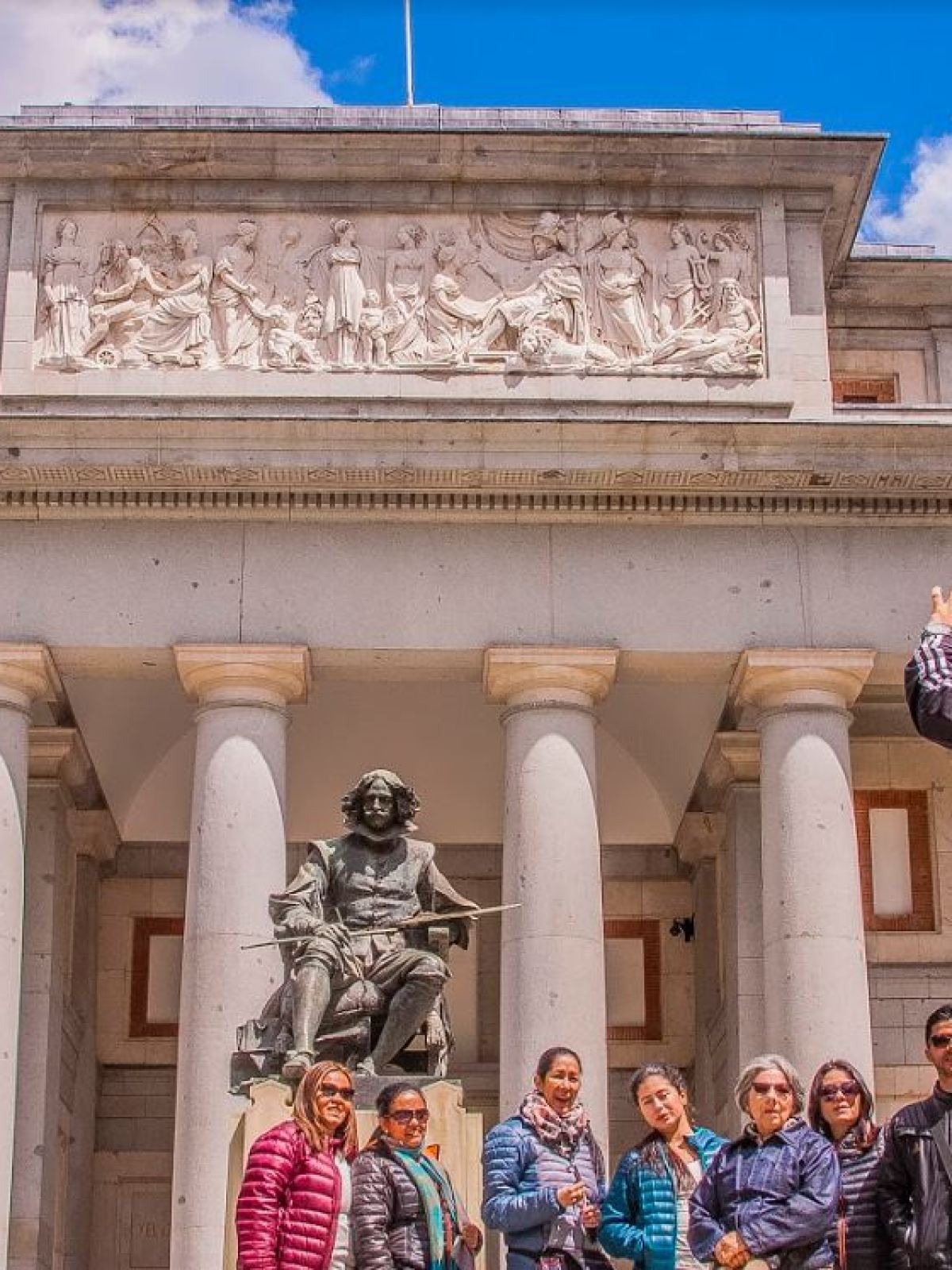 a group of people standing in front of a building