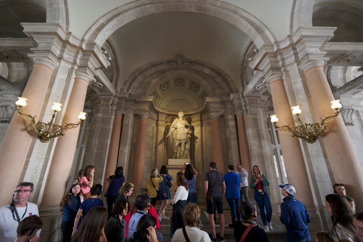a group of people standing in front of a building