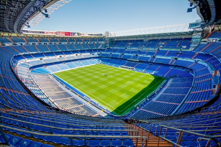 a stadium full of people with Santiago Bernabéu Stadium in the background