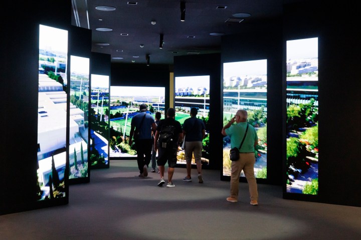 a group of people standing in front of a window
