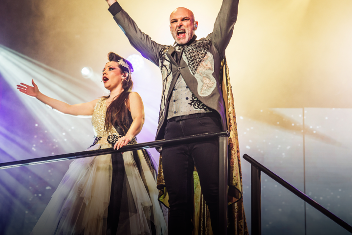 a man and a woman standing on a stage